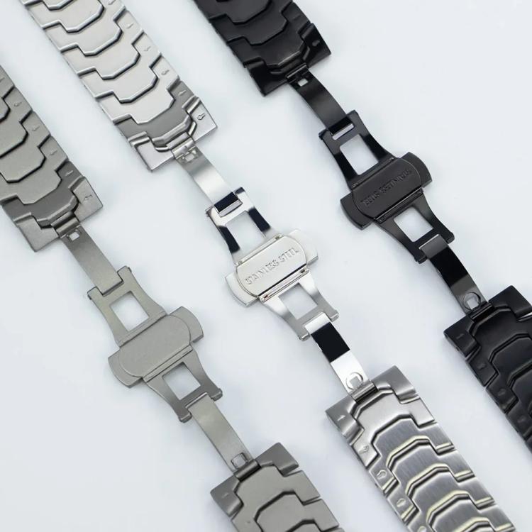 Black and silver watch bands showing their butterfly clasp mechanisms.