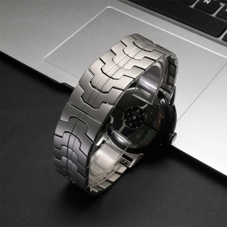Silver metal-link watch band wrapped around a smartwatch.