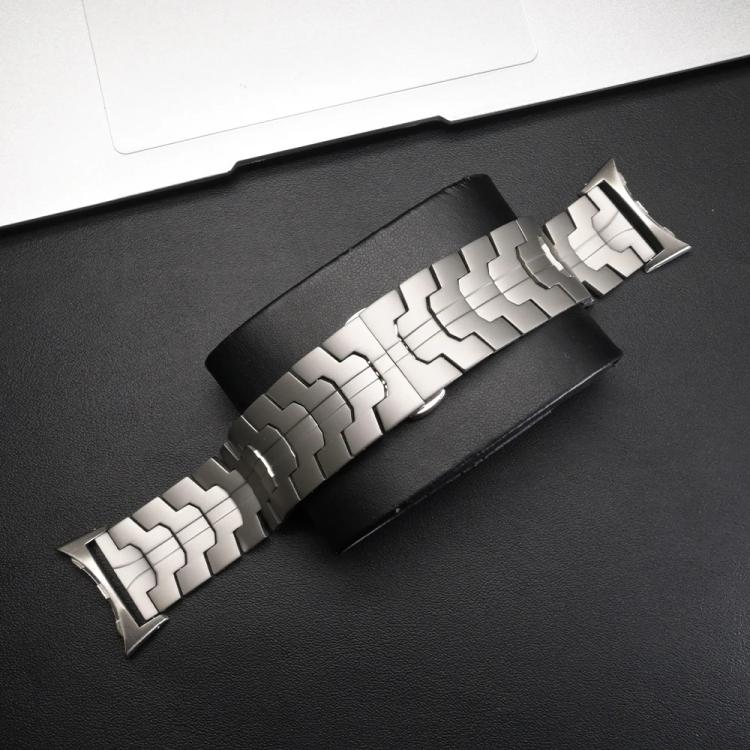 Silver metal-link watch band with a patterned link design.