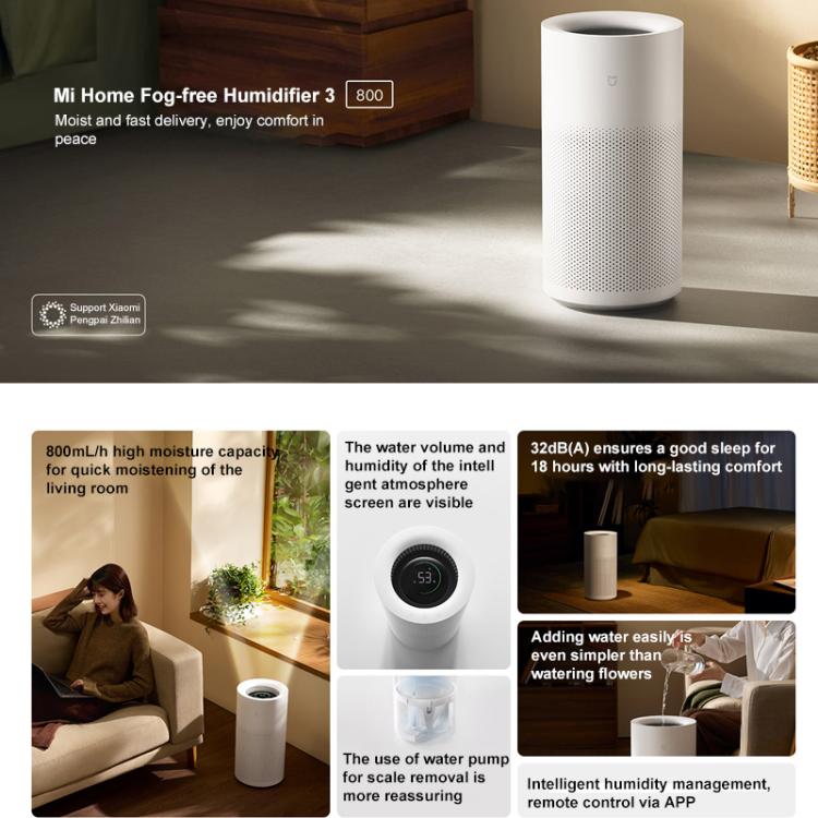 White cylinder no-mist humidifier standing on a table, perforated air vents