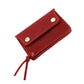 Red leather small zipper coin purse wallet with snap closure and hanging cord.