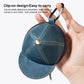 Blue cap-style coin purse with metal snap button and stitched curved brim, zip opening