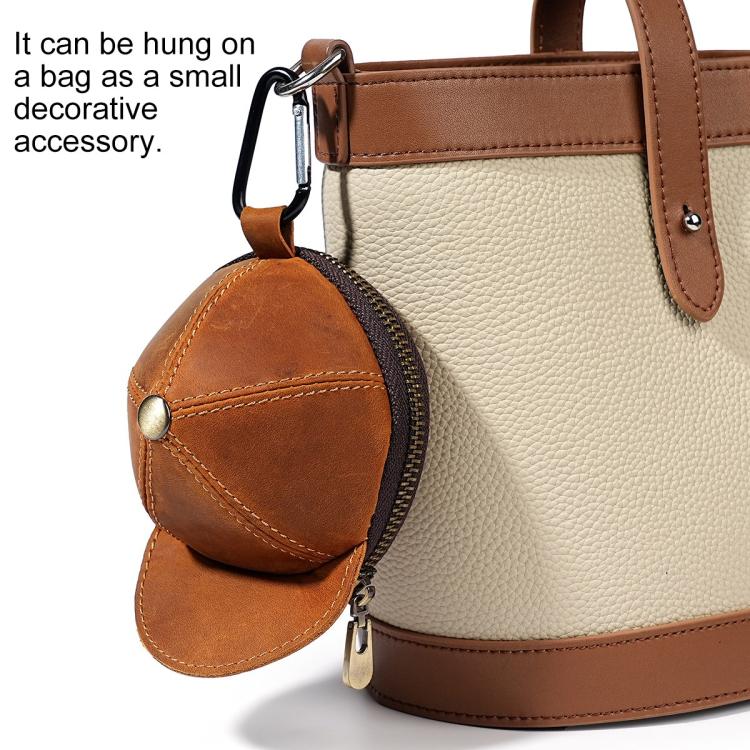 Tan and brown cap-style coin purse with zip closure and metal snap button