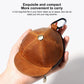 Tan-brown cap-style coin purse with metal snap button and stitched panel seams
