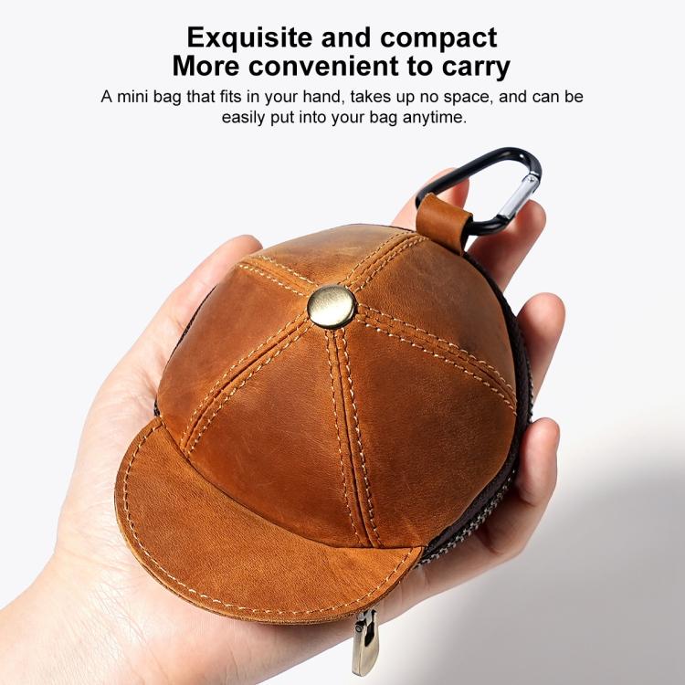 Tan-brown cap-style coin purse with metal snap button and stitched panel seams