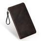 Dark brown leather large clutch wallet with wrist strap and top metal zipper