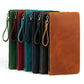 Assorted-color leather clutch wallets with wrist straps and top metal zippers