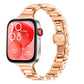 Rose gold stainless steel linked watch band with butterfly clasp, attached to a smartwatch.