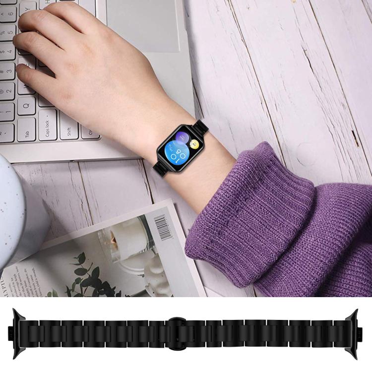 Black stainless steel watch band worn on the wrist, with a separate full-length band view