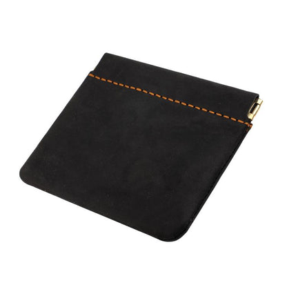 Black leather coin purse with top zipper and contrast orange stitch trim