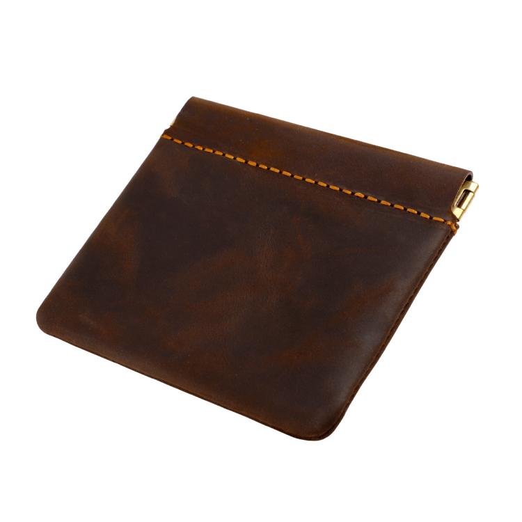 Dark brown leather coin purse with top zipper and contrast orange stitch trim