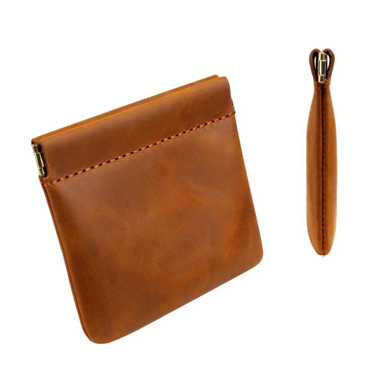 Brown leather coin purse with top zipper, orange stitching, and wrist strap