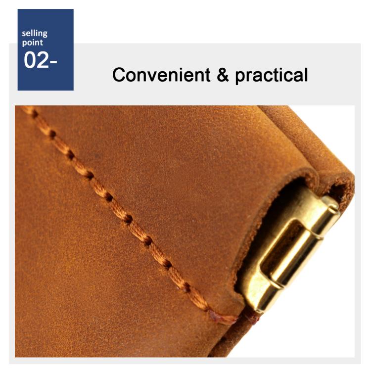Brown leather coin purse with brass snap clasp and stitched edge, close-up