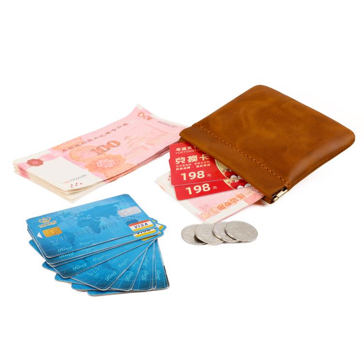 Brown leather coin purse holding cash and coins, hinged top with snap clasp