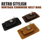 Leather waist bag in black and brown, with round star emblem and key ring hardware