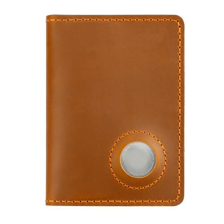 Vintage leather passport card holder in tan with circular tracker slot and contrast stitch trim