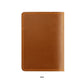 Back view of vintage leather passport card holder in tan with stitched border