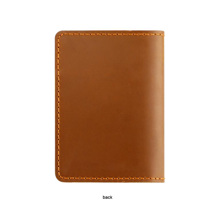 Back view of vintage leather passport card holder in tan with stitched border