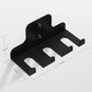 Black wall barbell storage rack with four cushioned cradle openings and bolts