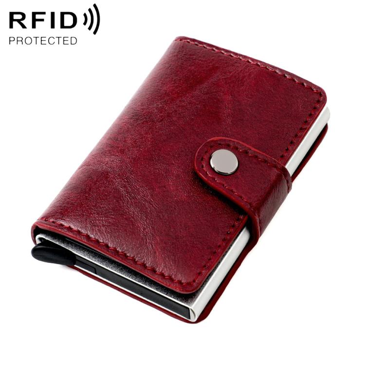 Wine red leather-look RFID multi-card wallet with snap strap and oval metal button.