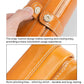Oil-waxed leather toiletry bag detail with metal snap button and contrast stitching