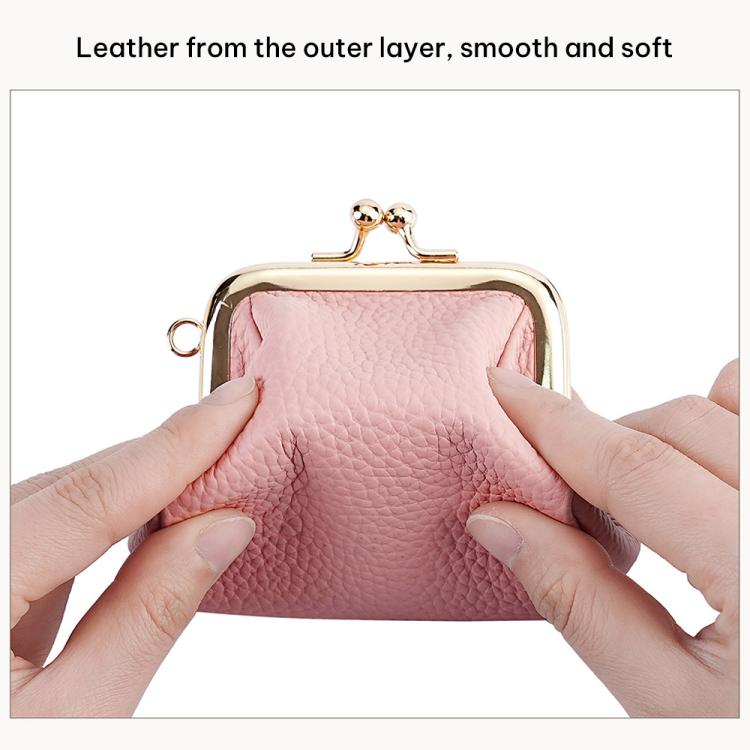 Pink pebble leather coin purse with kiss-lock frame, close-up of inner lining and clasp