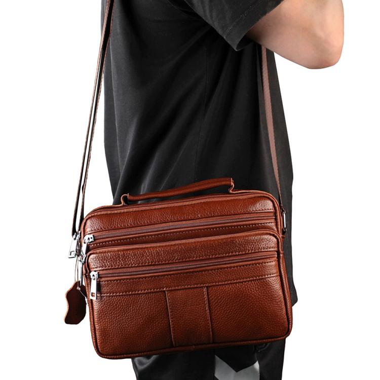 Brown leather crossbody shoulder bag with zip compartments and adjustable strap