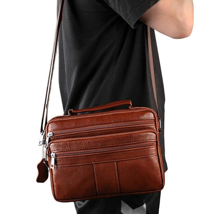 Brown leather crossbody shoulder bag with zip compartments and adjustable strap
