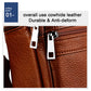 Close-up of brown cowhide leather shoulder bag with metal zippers and stitching