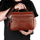 Brown top-grain cowhide crossbody handbag with front zipper pocket and adjustable strap
