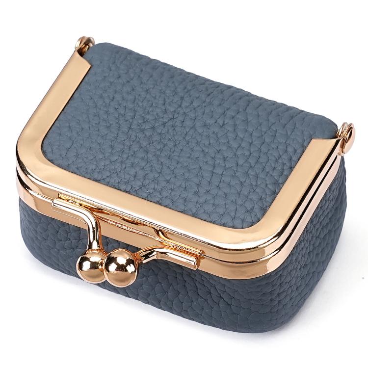 Denim blue mini jewelry storage bag with gold-tone clasp and hinged frame.