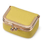 Pale yellow mini jewelry storage bag with gold-tone clasp and hinged frame.