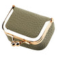 Khaki mini jewelry storage bag with gold-tone clasp and hinged frame.