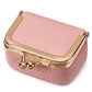 Pink quilted mini jewelry bag with gold-tone frame and clasp hardware