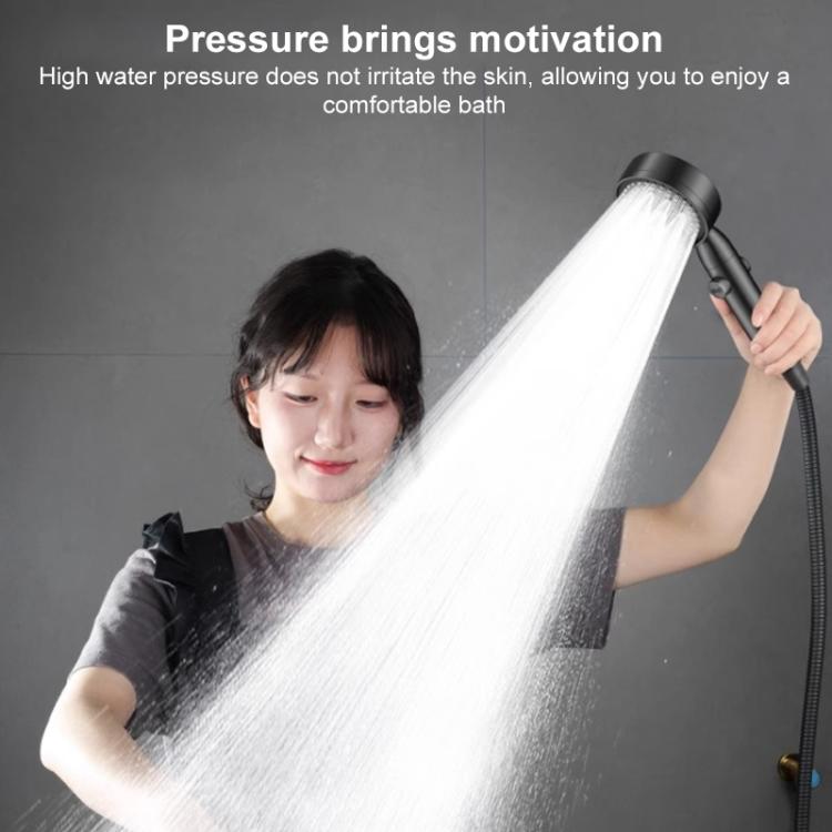Handheld shower head spraying a strong water stream, dark gray handle