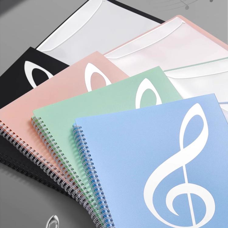 Assorted piano music sheet binder folders with colorful covers and spiral rings, fanned