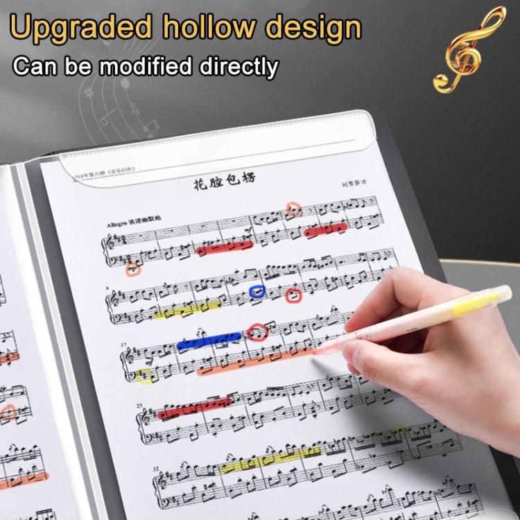 Piano music score binder open on sheet music with a hand holding a yellow pen