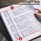 Piano music sheet binder folder open, showing sheet music pages with index tabs