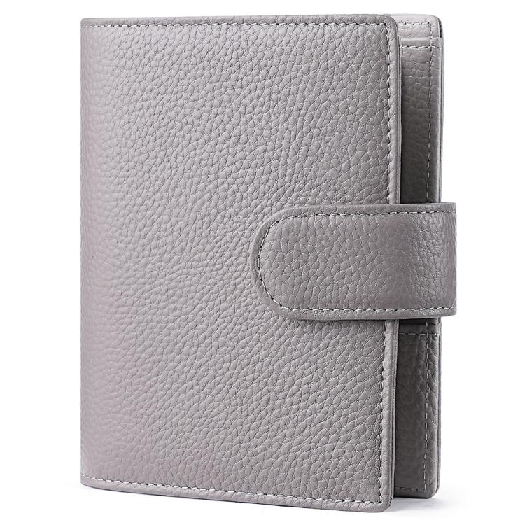 Light gray leather-look passport holder with attached notebook cover and side strap