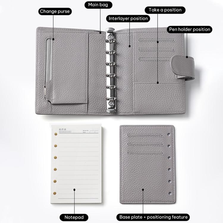 Light gray passport holder notebook open, showing card slots and pen holder