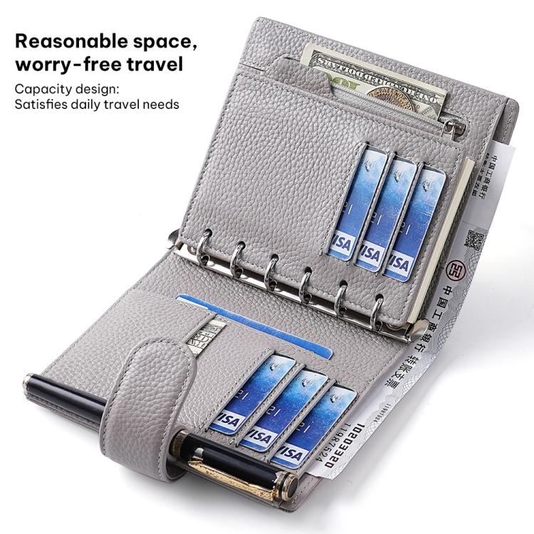 Light gray passport holder notebook open with card slots and pen holder section