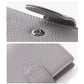 Loose-leaf notebook passport holder with pebble-grain texture and round metal clasp