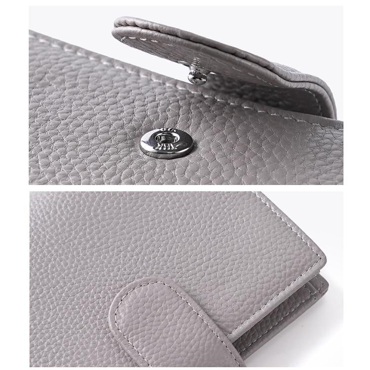 Loose-leaf notebook passport holder with pebble-grain texture and round metal clasp