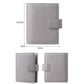 Loose-leaf notebook passport holder with flip strap closure and pebble-grain finish