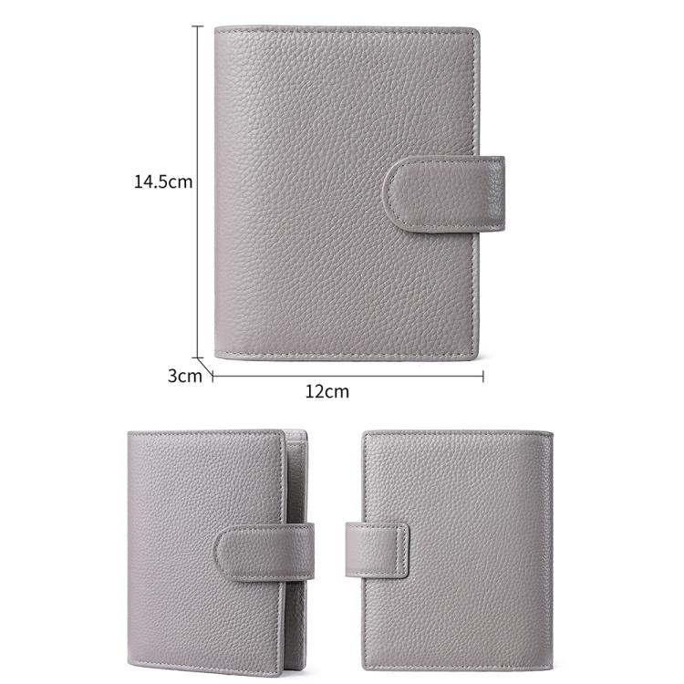 Loose-leaf notebook passport holder with flip strap closure and pebble-grain finish