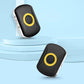 Black GPS location tracker with yellow-ring button, angled view on light surface