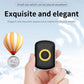 Small black GPS location tracker key fob with yellow circular indicator button