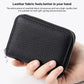 Black genuine leather zip card bag with textured grain, held in hand