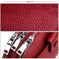 Red genuine leather crossbody bag close-up of pebbled texture and silver zipper detail