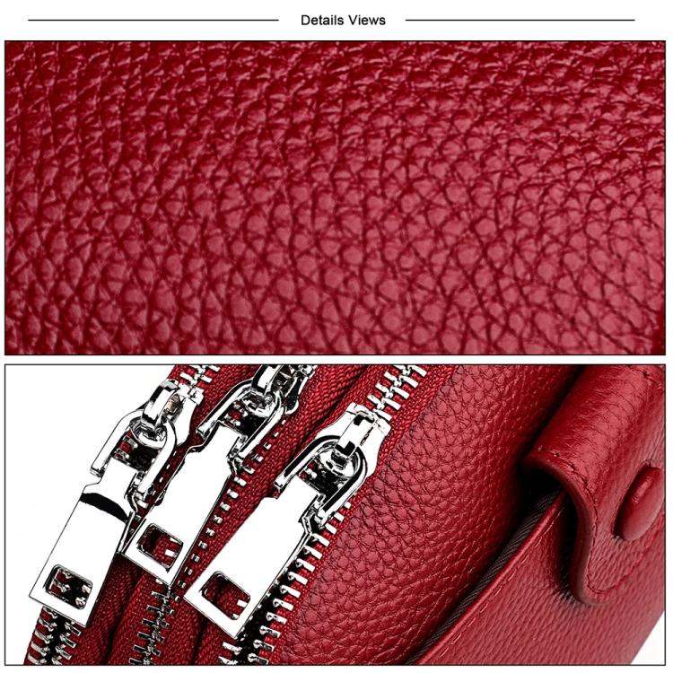 Red genuine leather crossbody bag close-up of pebbled texture and silver zipper detail